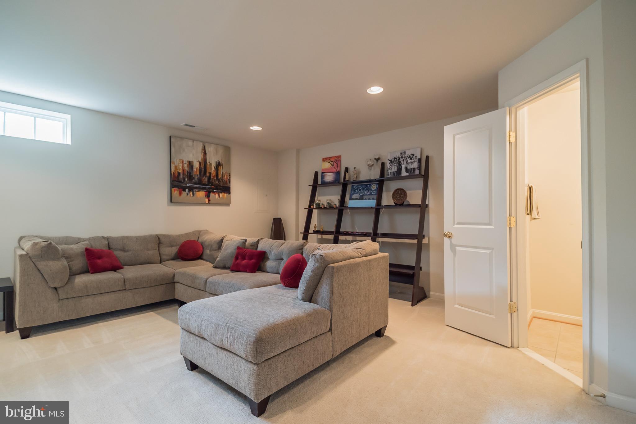 11886 Benton Lake Road Bristow, VA 20136 - Photo 3 of 27 Lower Level Family Room with 1/2 bath