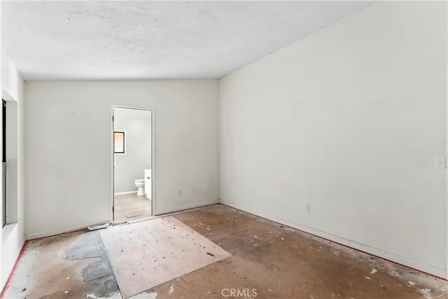 a view of bathroom with a toilet sink and mirror