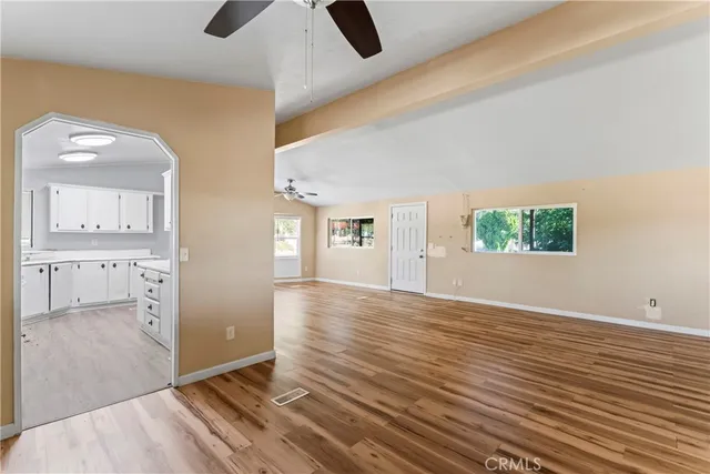 wooden floor in an empty room and a window