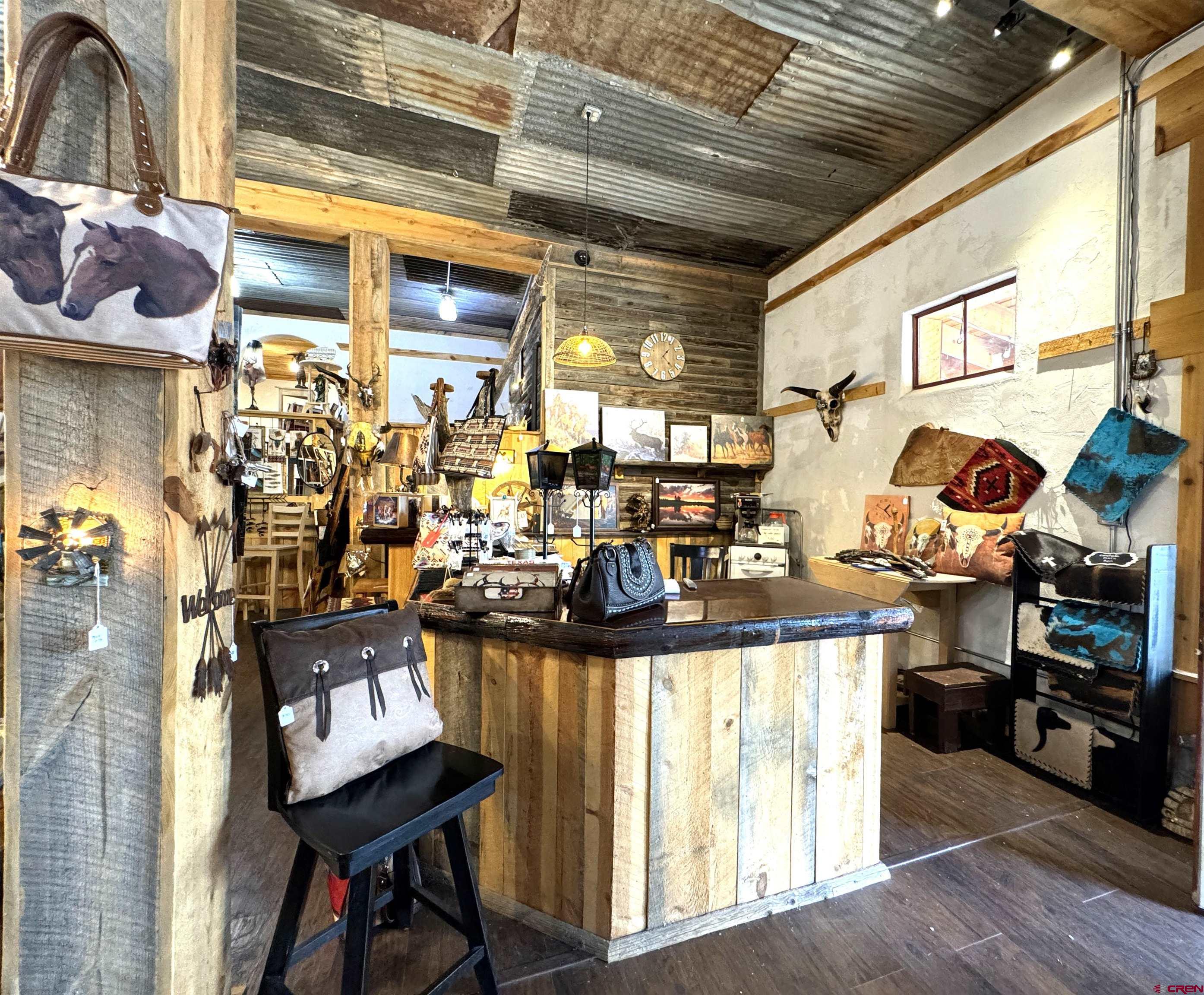 90 North Mildred Road Cortez, CO 81321 - Photo 11 of 26 a kitchen with stainless steel appliances granite countertop a stove and cabinets