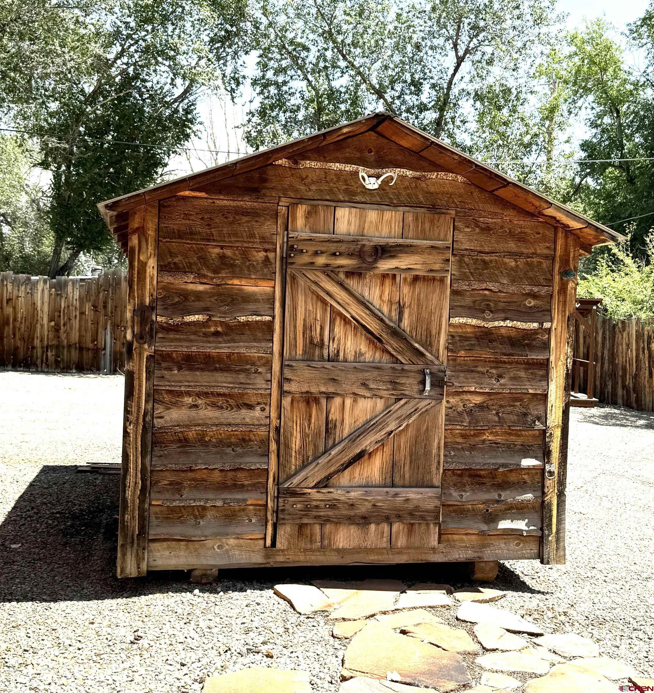 90 North Mildred Road Cortez, CO 81321 - Photo 7 of 26 a front view of a house with a yard