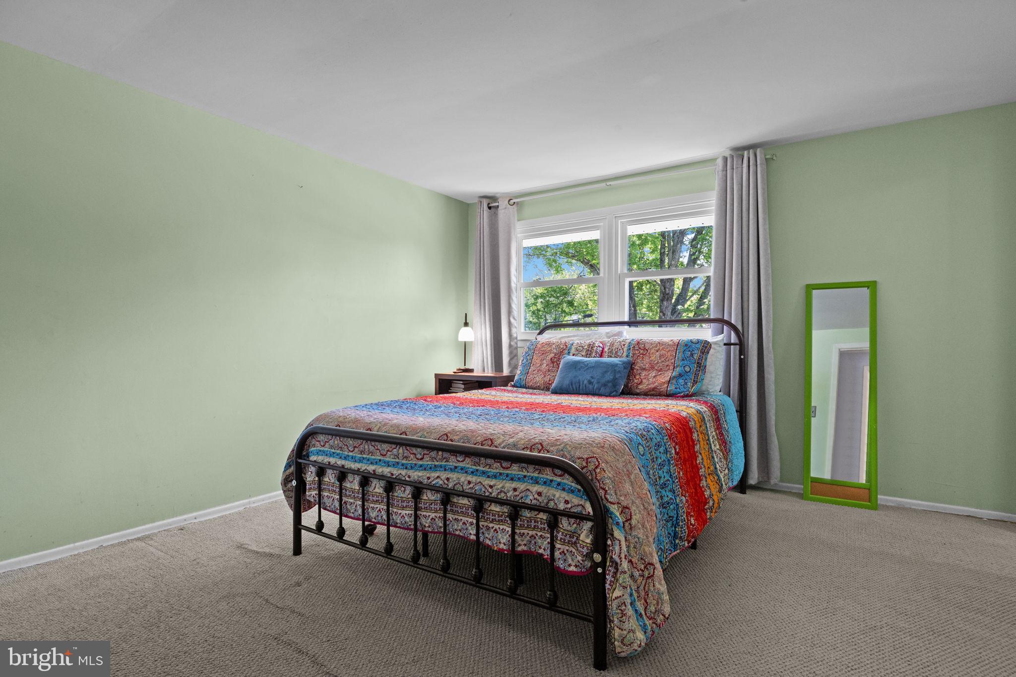 238 Centennial Road Warminster, PA 18974 - Photo 15 of 34 a bed sitting in a bedroom next to a window