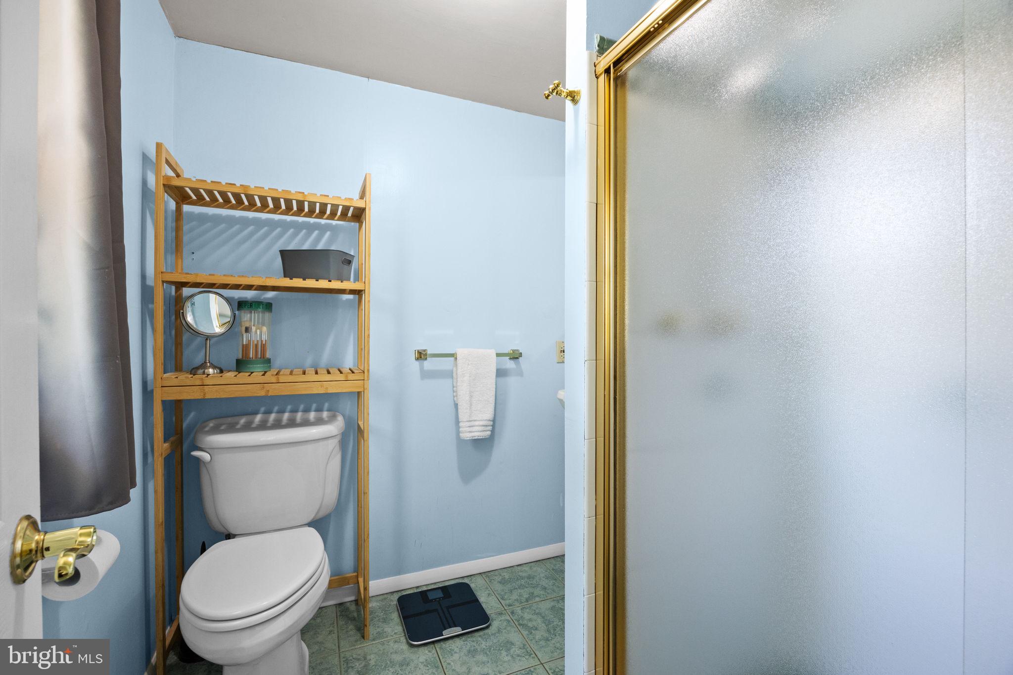 238 Centennial Road Warminster, PA 18974 - Photo 17 of 34 a white toilet sitting next to a bathroom sink