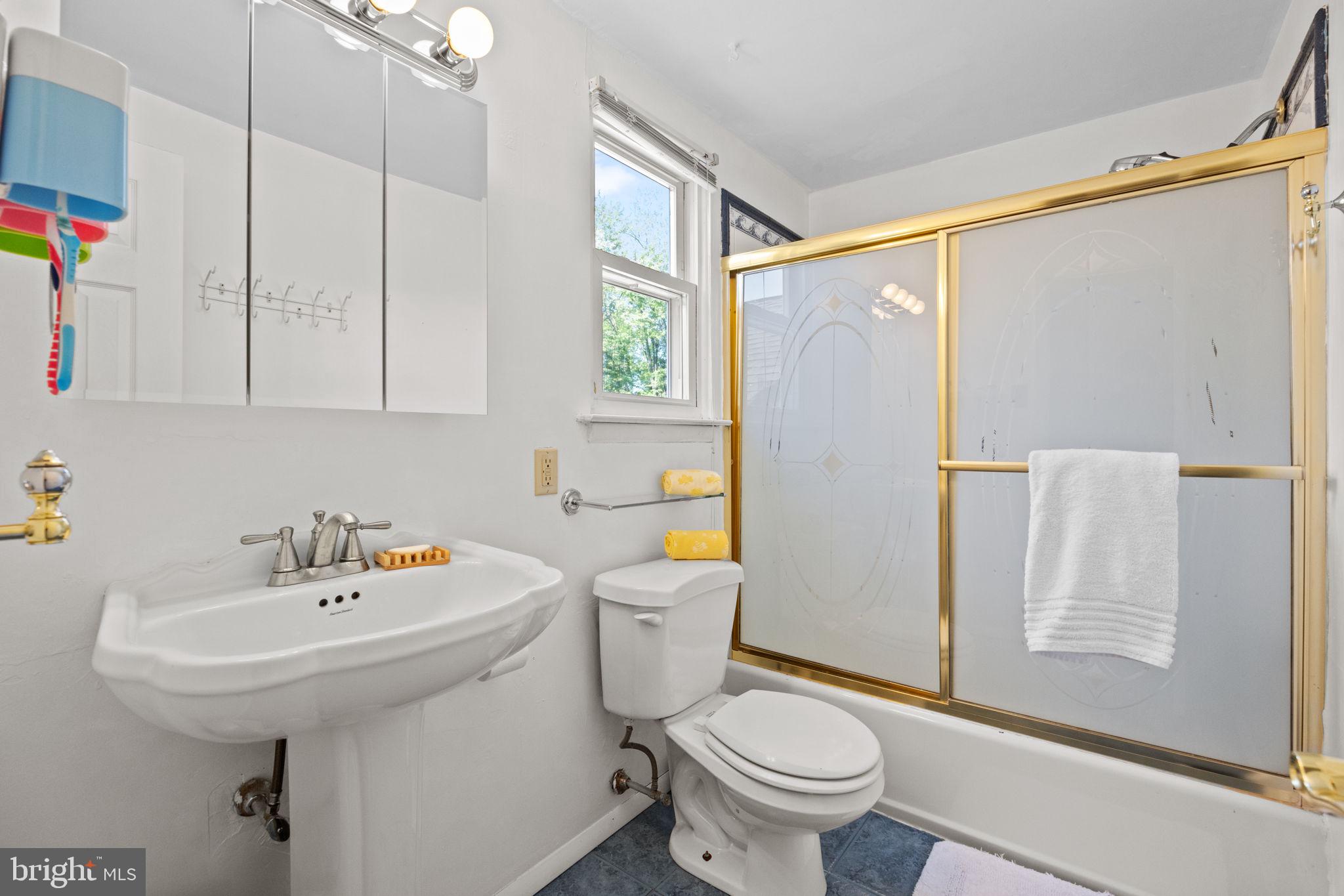 238 Centennial Road Warminster, PA 18974 - Photo 23 of 34 a bathroom with a sink toilet and shower