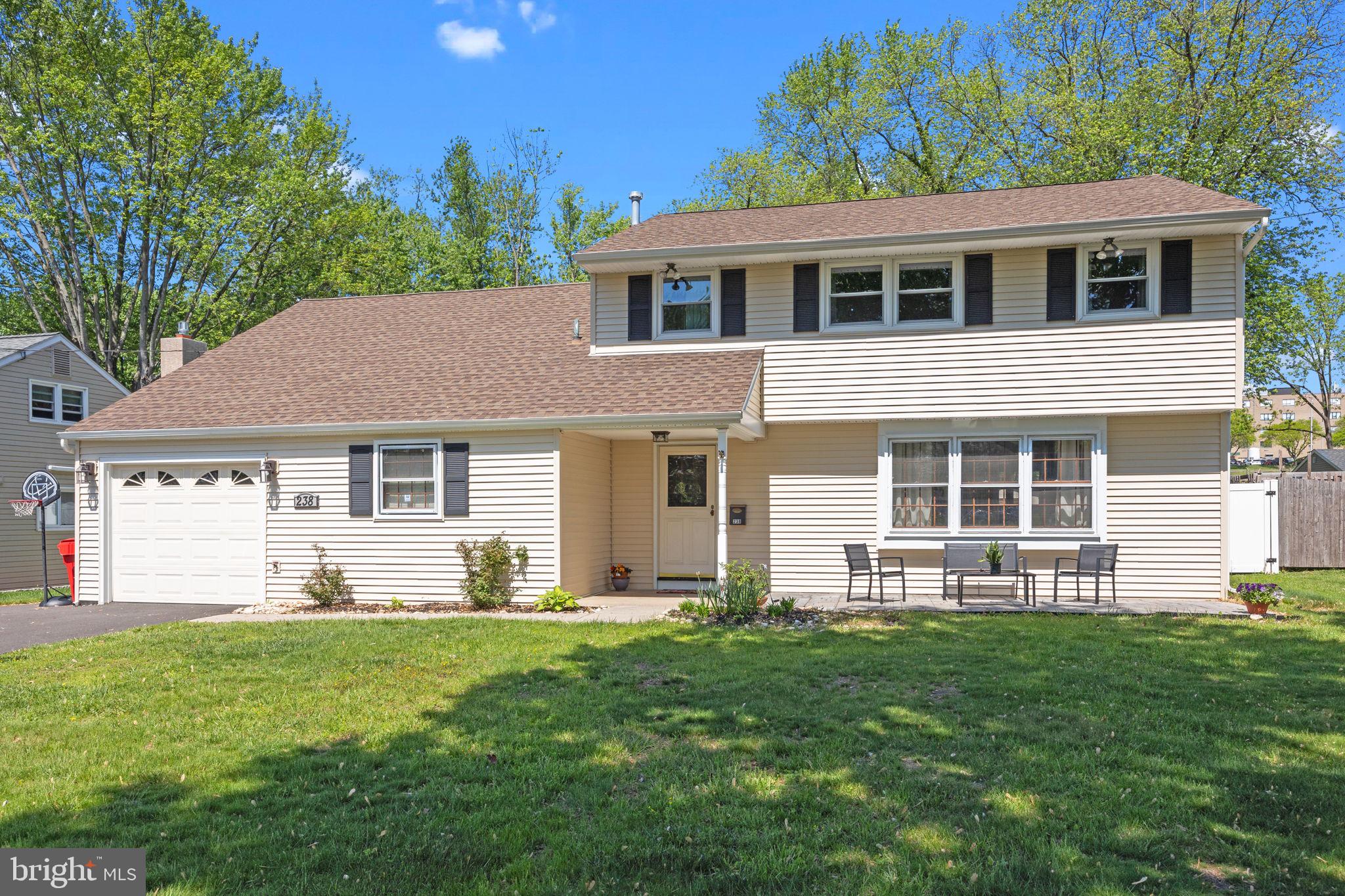 238 Centennial Road Warminster, PA 18974 - Photo 27 of 34 a front view of a house with a yard and garage