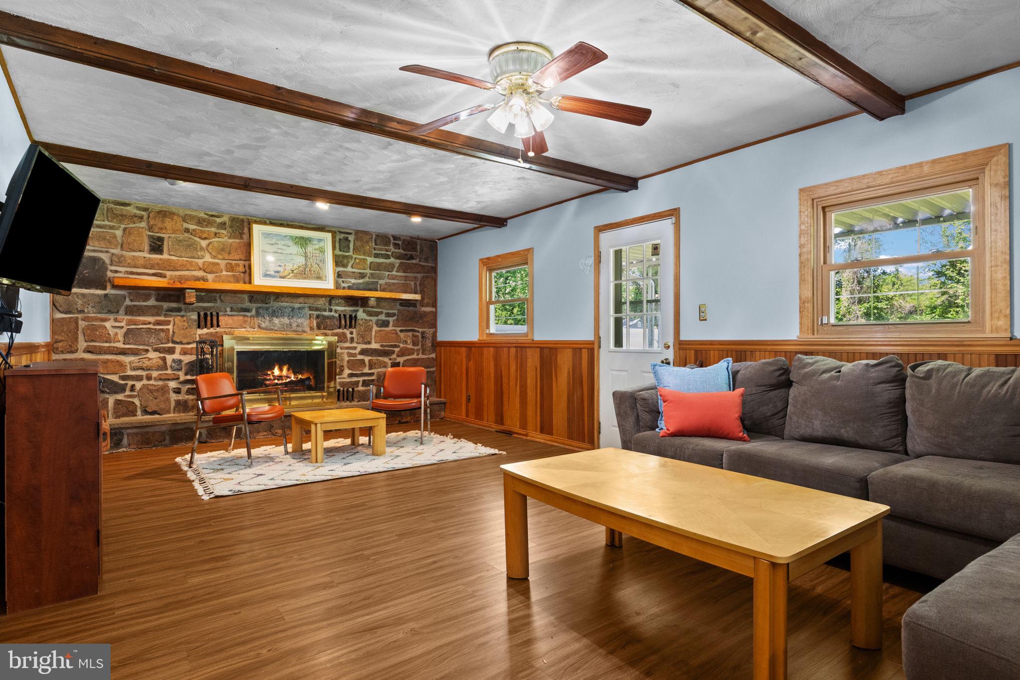 238 Centennial Road Warminster, PA 18974 - Photo 9 of 34 a living room with fireplace furniture and a flat screen tv