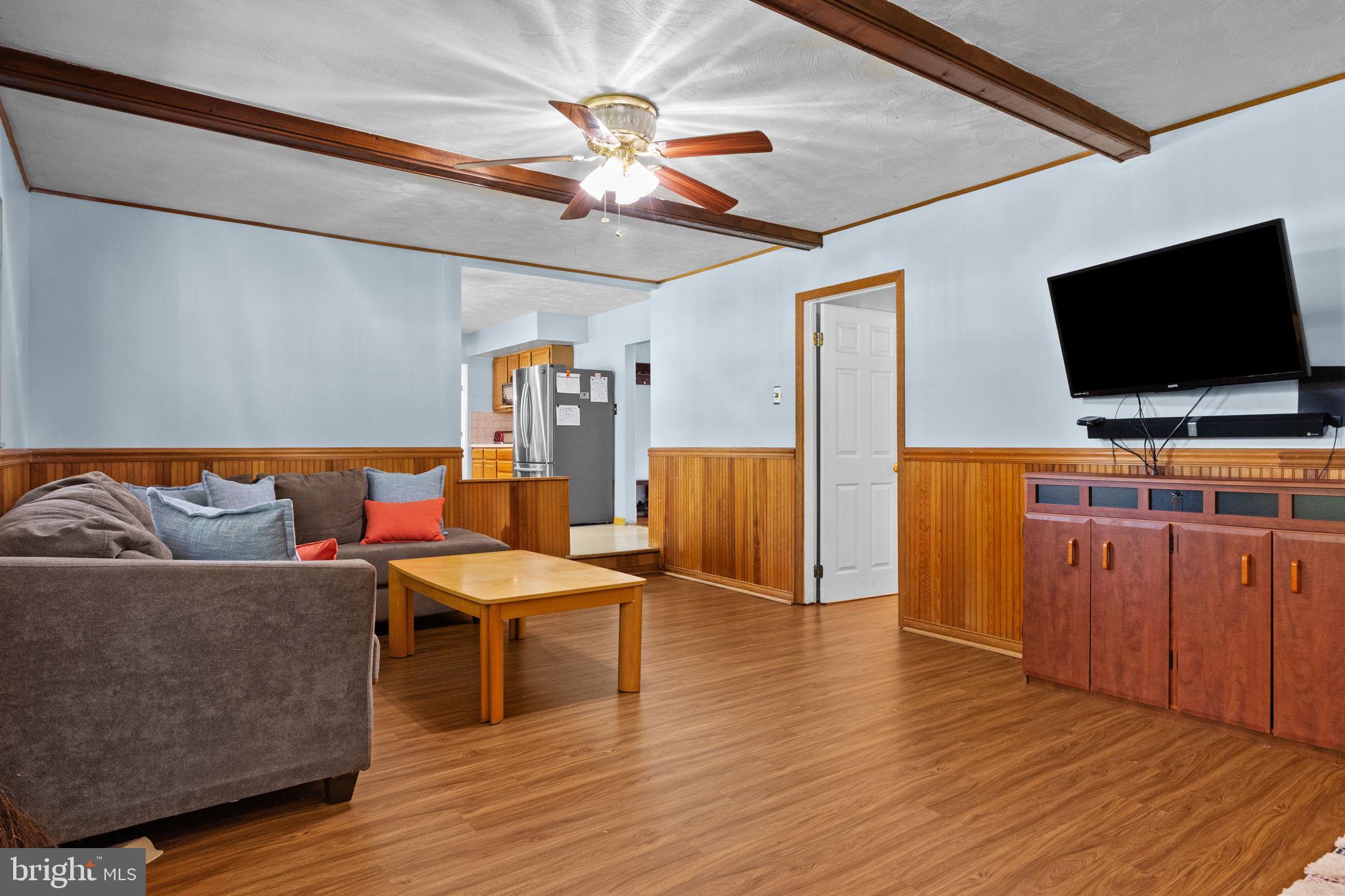 238 Centennial Road Warminster, PA 18974 - Photo 10 of 34 a living room with furniture and a flat screen tv