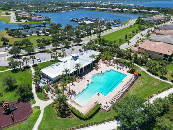 an aerial view of a residential houses with outdoor space