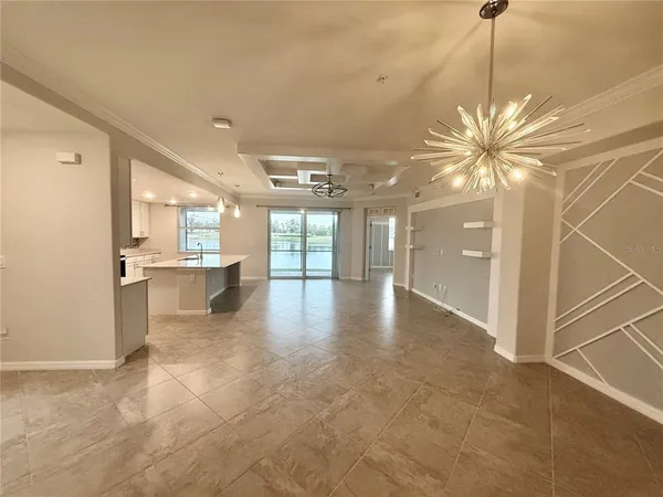 a view of a kitchen with a sink and a chandelier