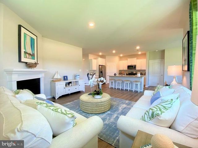 a spacious bedroom with a bed and a dresser