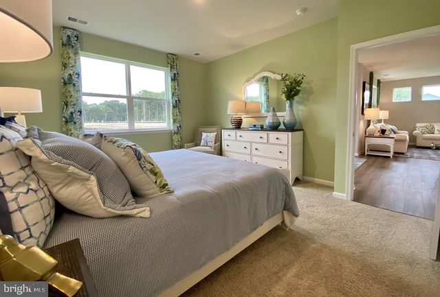 a bed room with a bed and a lamp