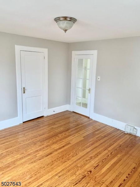 927 South Park Terrace, Unit 2 Union, NJ 07083 - Photo 3 of 12 a view of empty room with wooden floor and fan