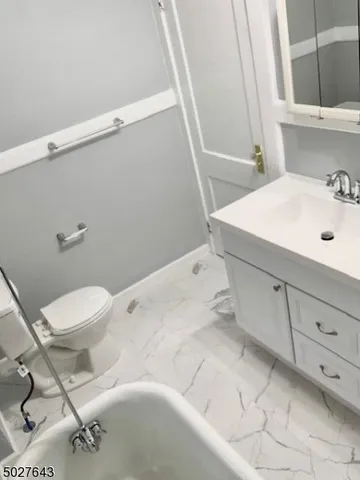 a bathroom with a sink and toilet