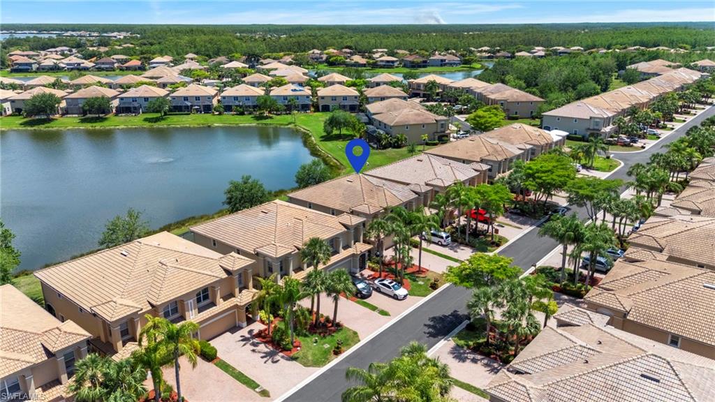20467 Larino Loop Estero, FL 33928 - Photo 2 of 45 an aerial view of a house with a lake view