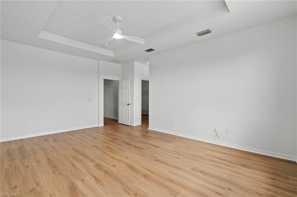 20467 Larino Loop Estero, FL 33928 - Photo 23 of 45 a view of an empty room with wooden floor