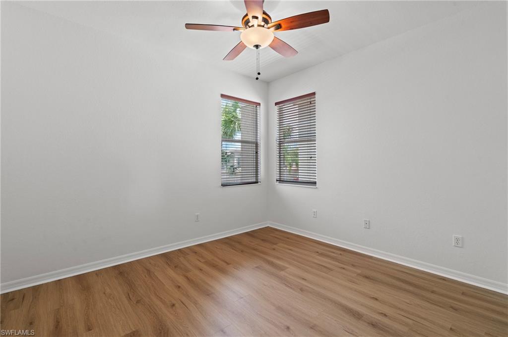 20467 Larino Loop Estero, FL 33928 - Photo 27 of 45 wooden floor in an empty room with a window