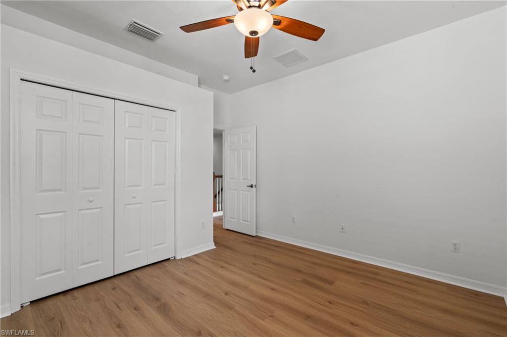 20467 Larino Loop Estero, FL 33928 - Photo 28 of 45 a view of an empty room with wooden floor