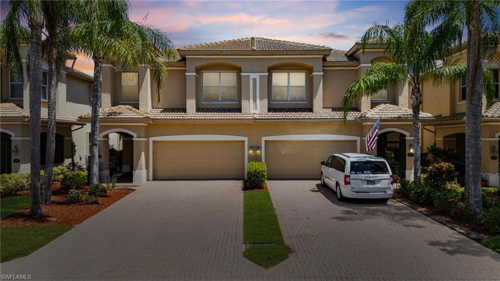 20467 Larino Loop Estero, FL 33928 - Photo 3 of 45 a view of a car park in front of house