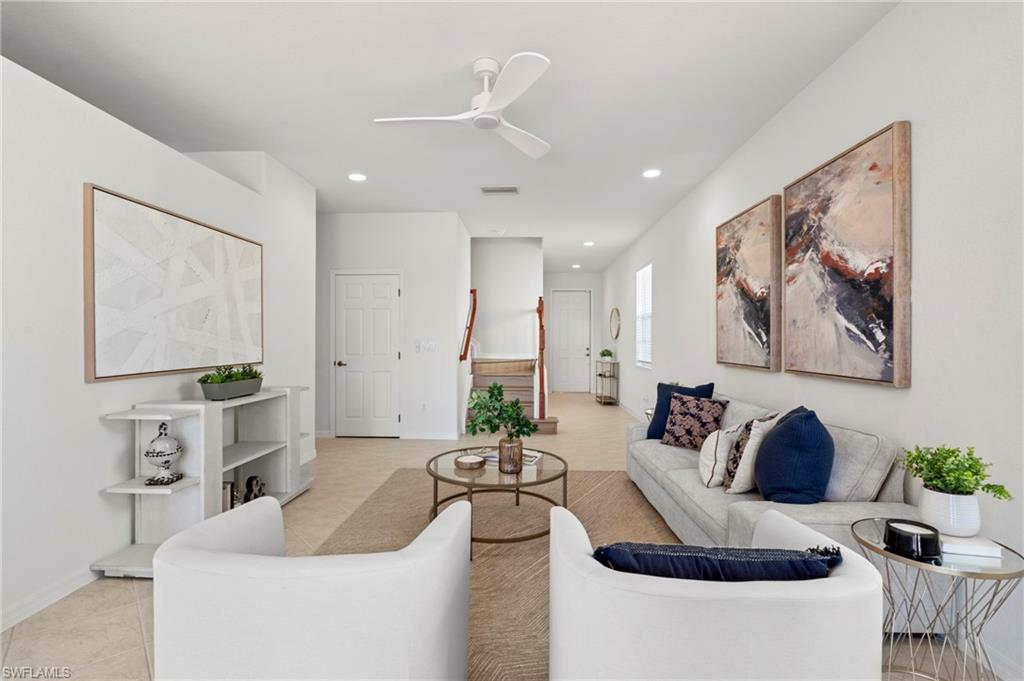 20467 Larino Loop Estero, FL 33928 - Photo 8 of 45 a living room with furniture and a large window