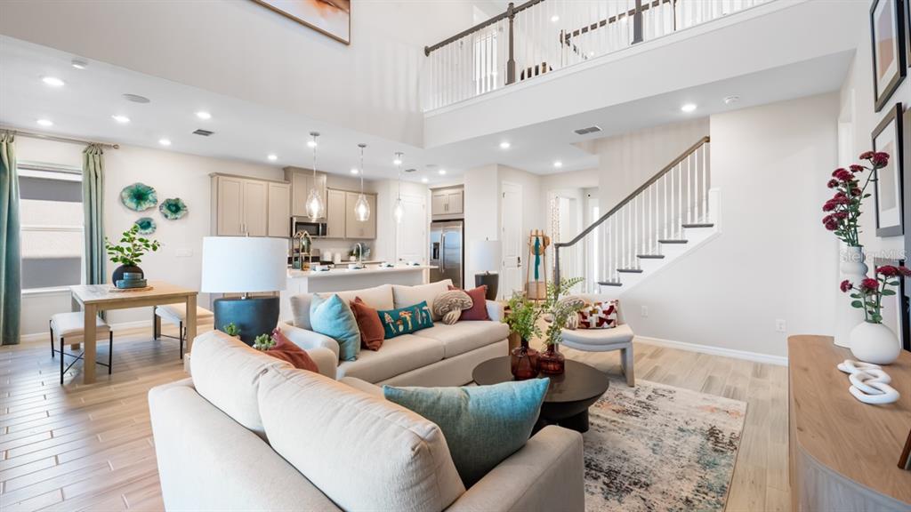 13333 Stable Place Parrish, FL 34219 - Photo 14 of 33 a living room with furniture and wooden floor