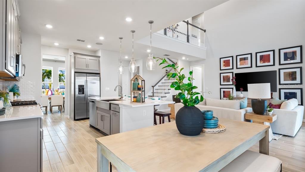 13333 Stable Place Parrish, FL 34219 - Photo 25 of 33 a kitchen with sink and refrigerator