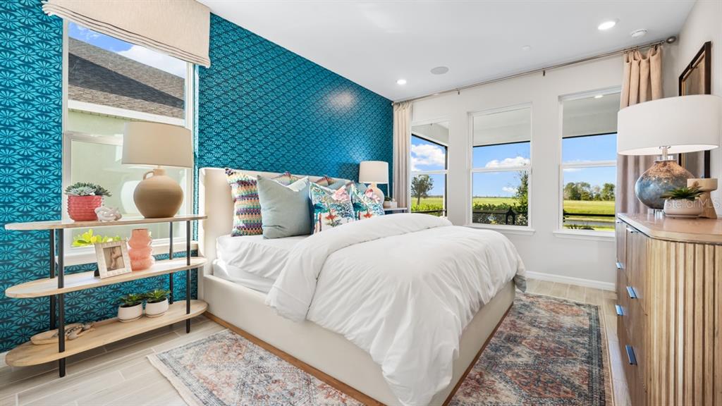 13333 Stable Place Parrish, FL 34219 - Photo 26 of 33 a bedroom with a bed mirror and window