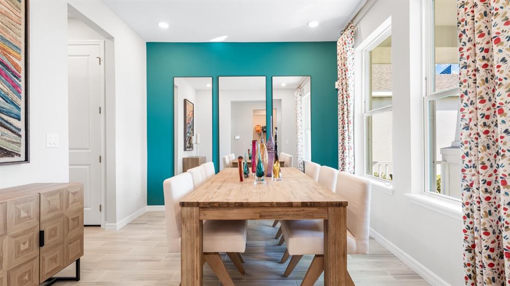 13333 Stable Place Parrish, FL 34219 - Photo 7 of 33 a dining room with a table chairs and entryway