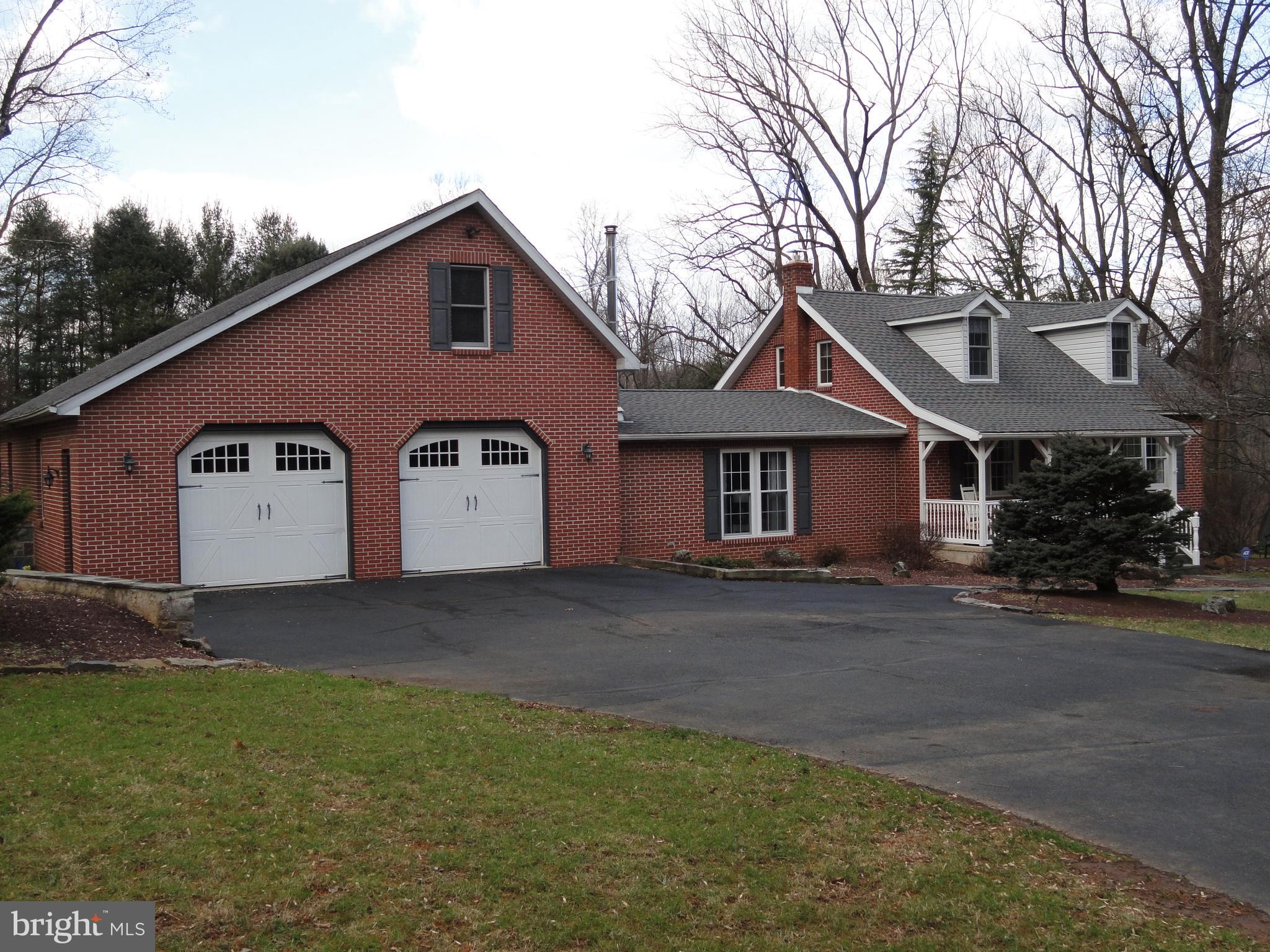 793 Henning Road Perkiomenville, PA 18074 - Photo 1 of 67 Front left view of this all brick custom cape cod