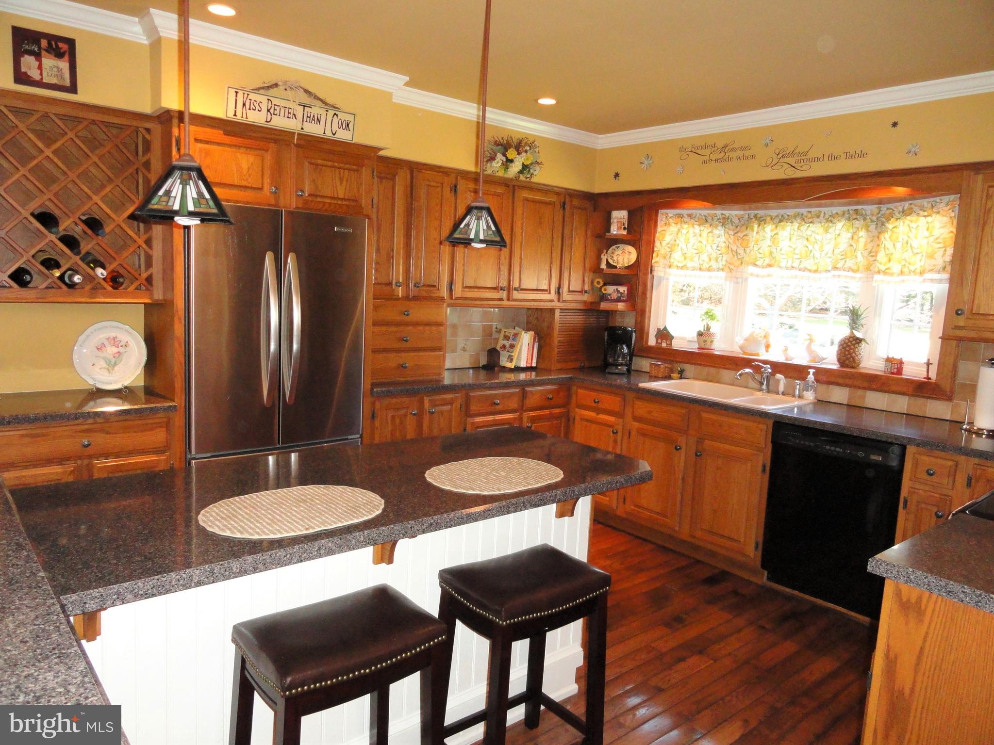 793 Henning Road Perkiomenville, PA 18074 - Photo 11 of 67 Kitchen with hardwood floors and crown molding.