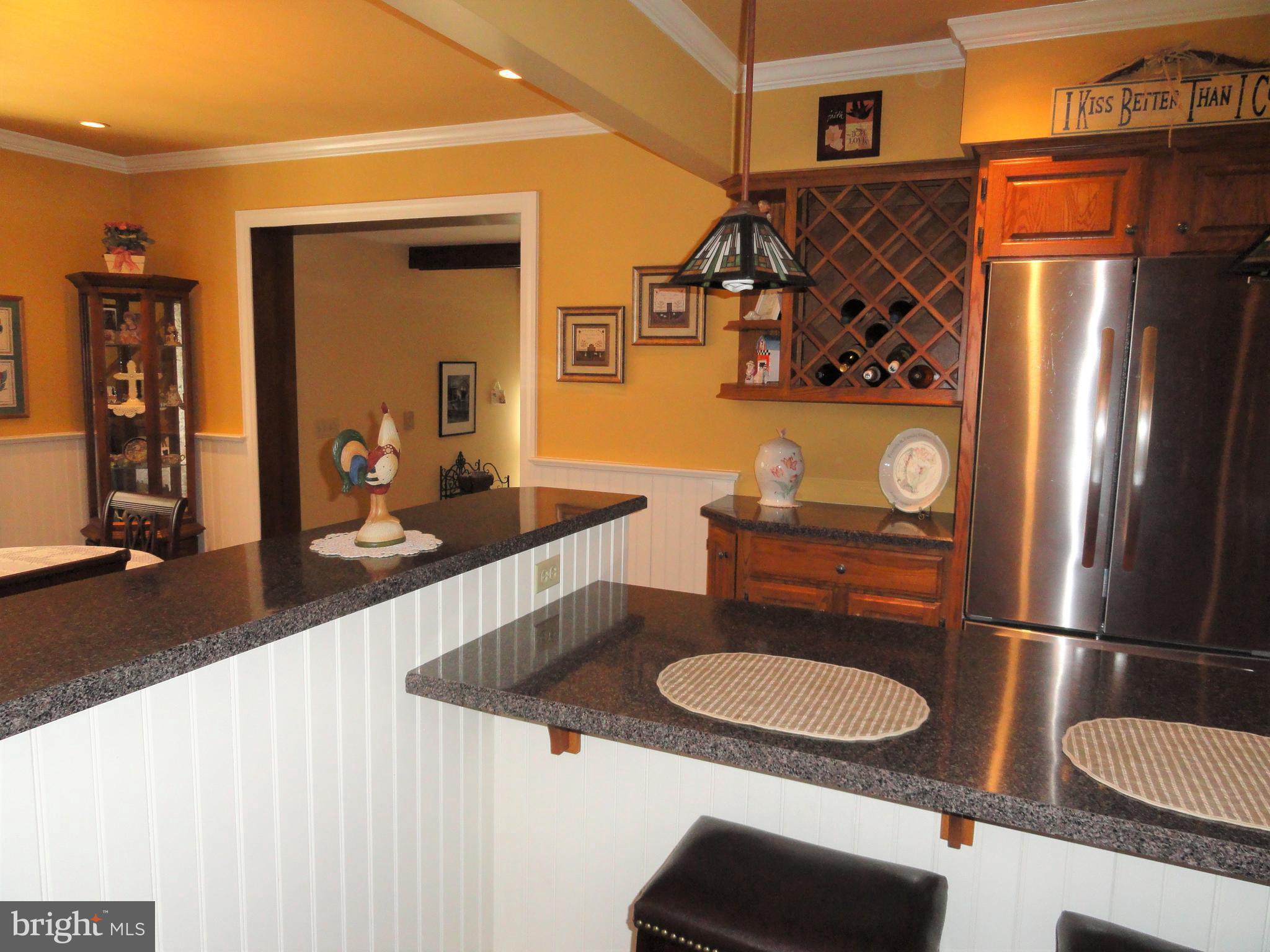 793 Henning Road Perkiomenville, PA 18074 - Photo 16 of 67 Kitchen with SS refrigerator & wine rack.