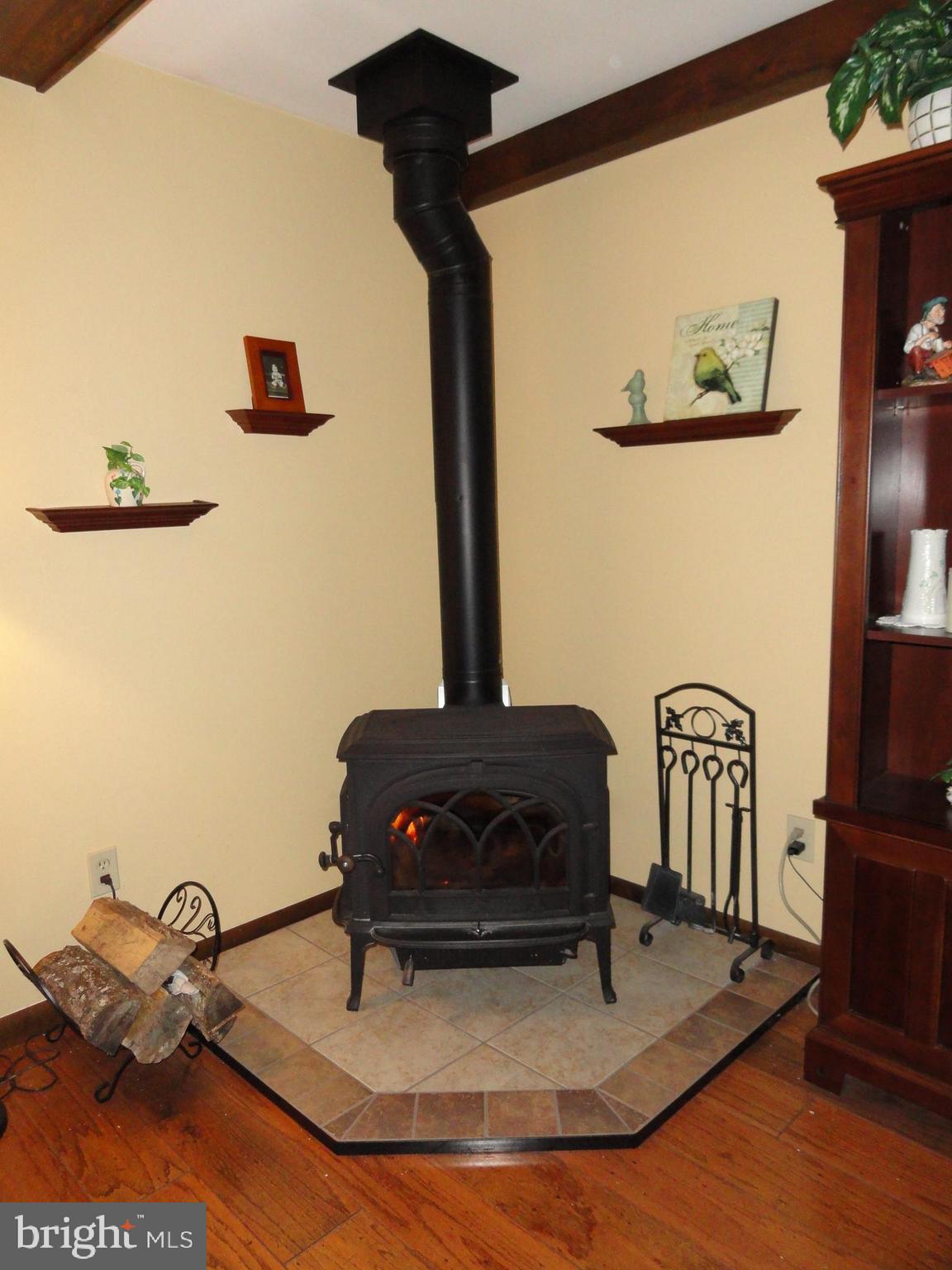 793 Henning Road Perkiomenville, PA 18074 - Photo 23 of 67 Corner wood stove in living rm adds charm and heat
