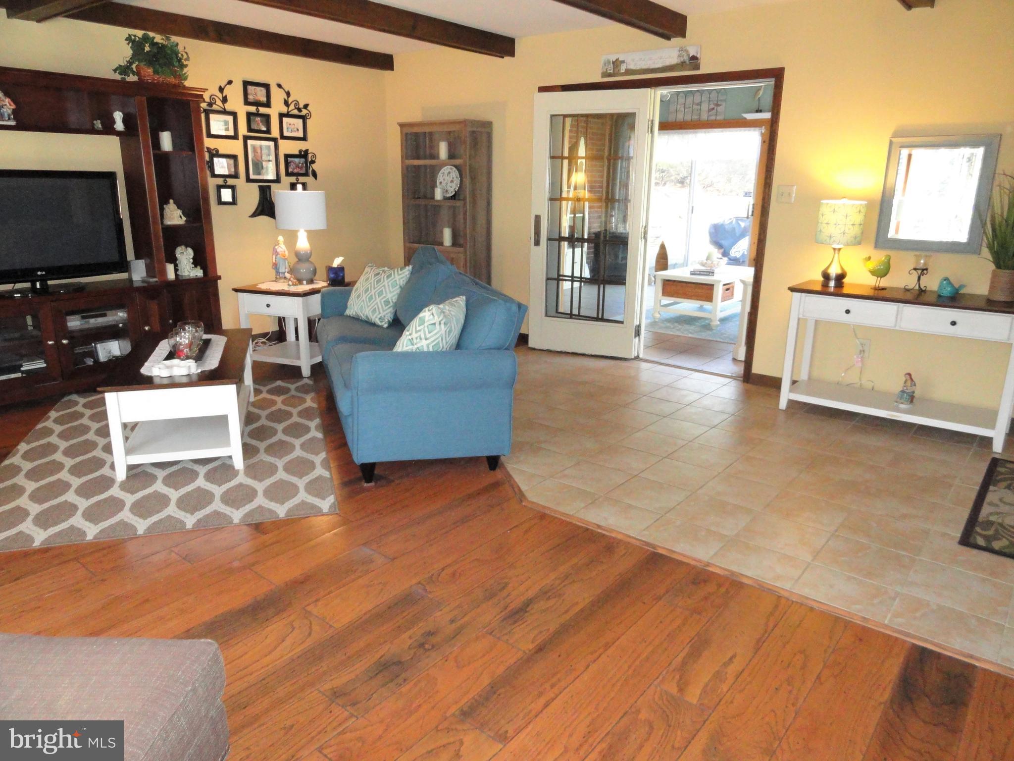 793 Henning Road Perkiomenville, PA 18074 - Photo 24 of 67 Living room with tile entrance into sun room.