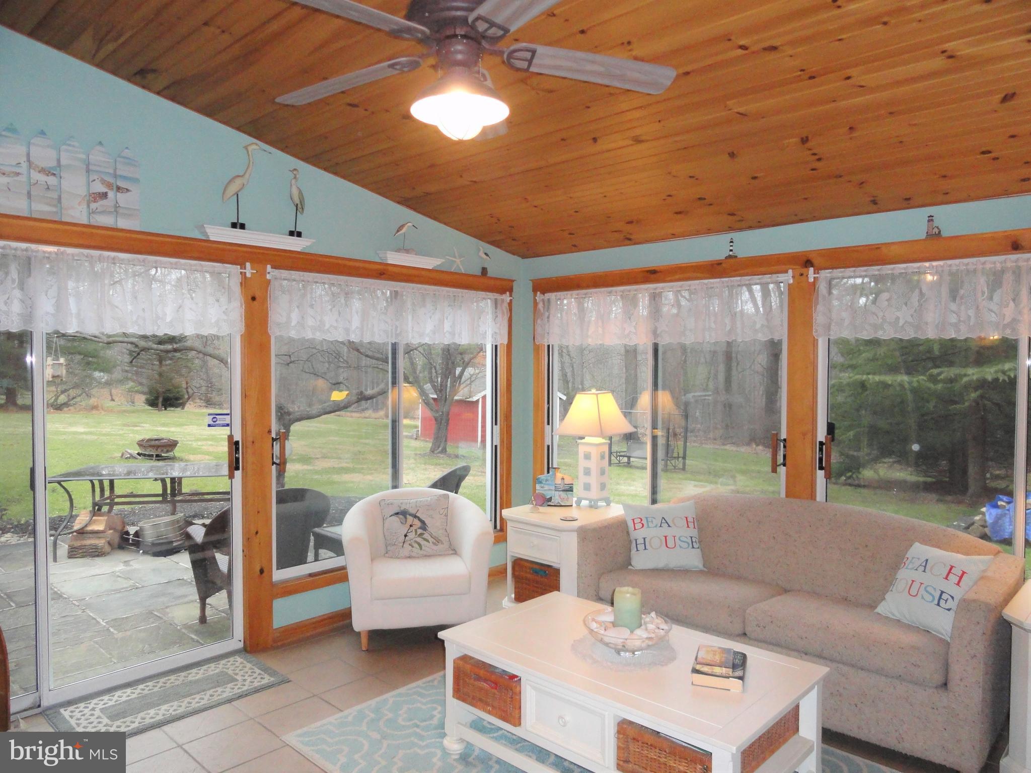 793 Henning Road Perkiomenville, PA 18074 - Photo 26 of 67 Sun room with tile floor and vaulted wood ceiling