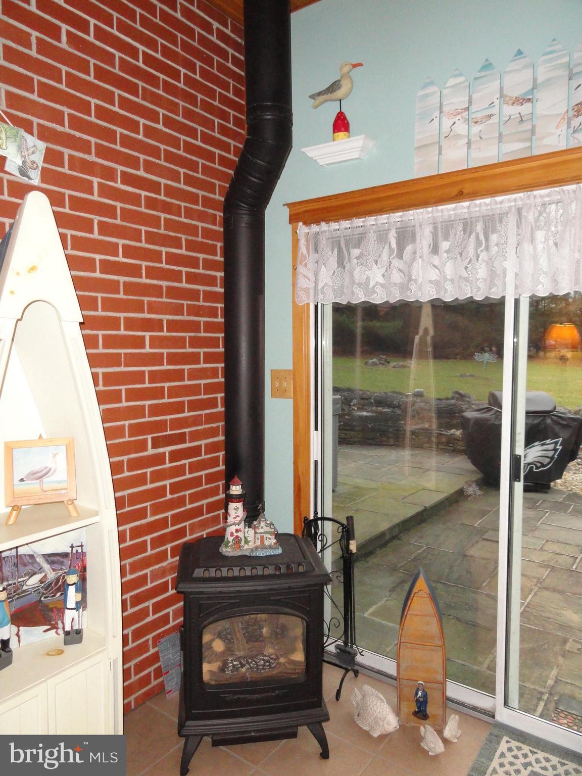 793 Henning Road Perkiomenville, PA 18074 - Photo 30 of 67 Sun room with propane stove for cold mornings
