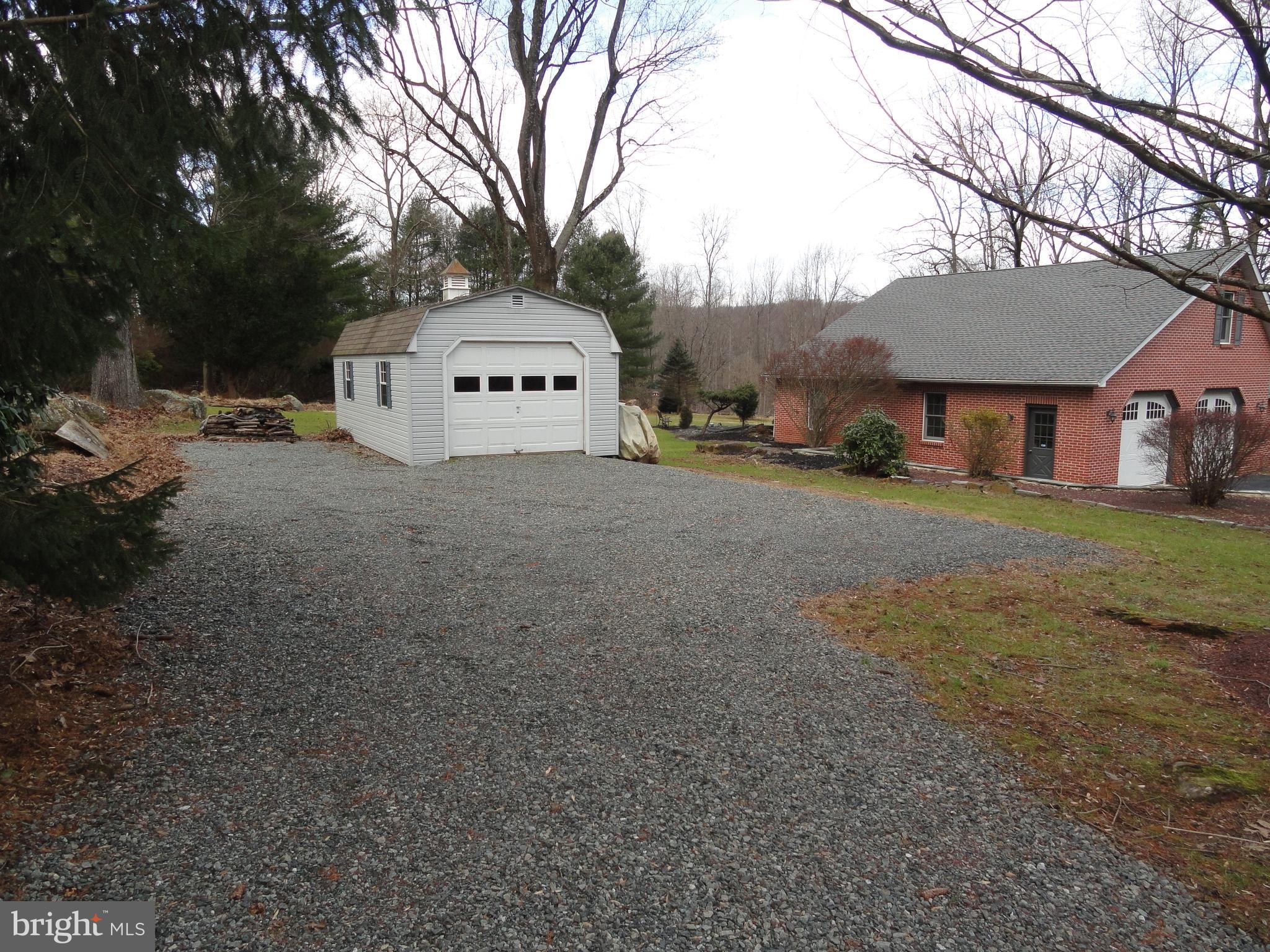 793 Henning Road Perkiomenville, PA 18074 - Photo 7 of 67 One car det. garage with separate stone driveway