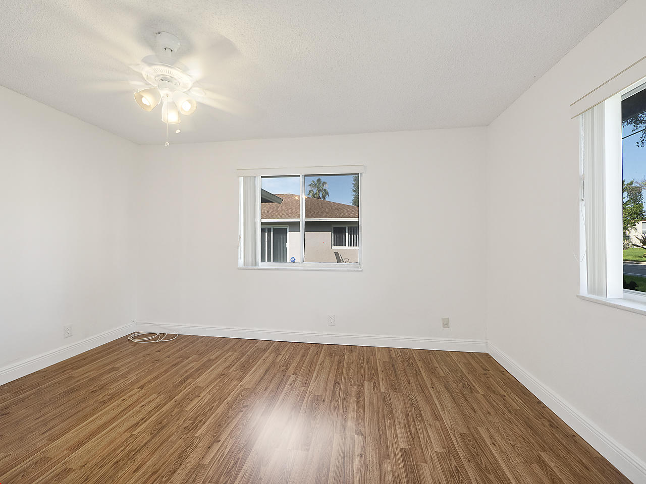 6723 Moonlit Drive Delray Beach, FL 33446 - Photo 12 of 16 a view of a room with wooden floor and a window