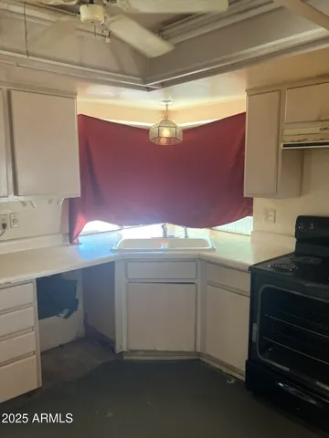a kitchen with a sink and cabinets