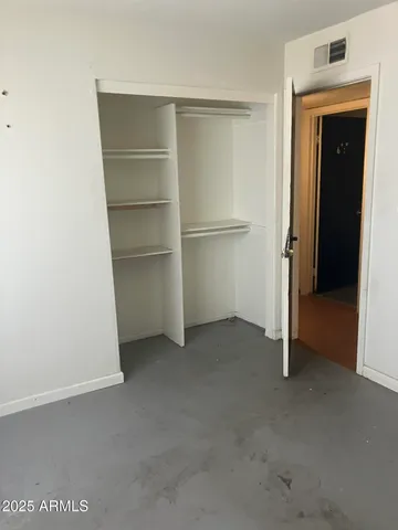 a white toilet sitting next to a bath tub