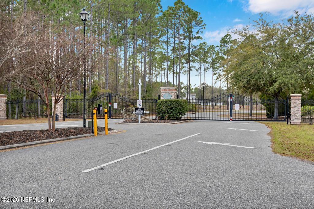 15364 Bullock Bluff Road Bryceville, FL 32009 - Photo 2 of 24 a view of street with large trees
