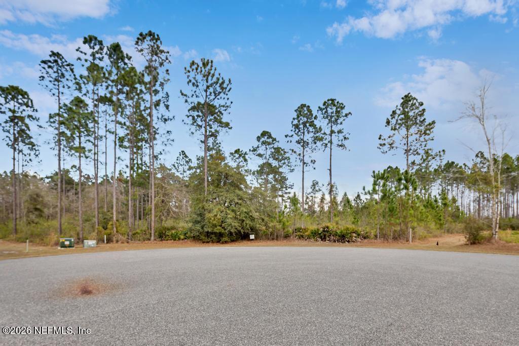 15364 Bullock Bluff Road Bryceville, FL 32009 - Photo 4 of 24 a view of a street with a building in the background