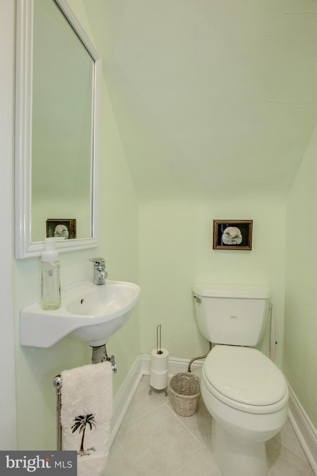 8632 Geren Road, Unit 158 Silver Spring, MD 20901 - Photo 9 of 20 a bathroom with a toilet a sink and mirror