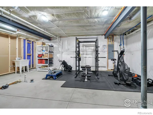 a room with lots of furniture and white walls