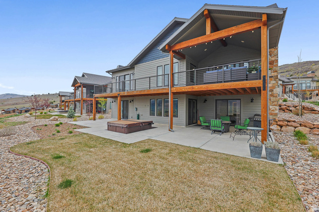 4527 North Seven Bridges Road Eden, UT 84310 - Photo 8 of 65 Rear view of property featuring a patio area, a lawn, and a wooden deck