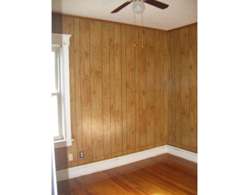 43 William Street Fall River, MA 02721 - Photo 3 of 7 a view of an empty room with wooden floor