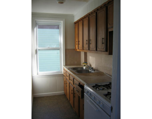 43 William Street Fall River, MA 02721 - Photo 6 of 7 a kitchen with a sink and a stove