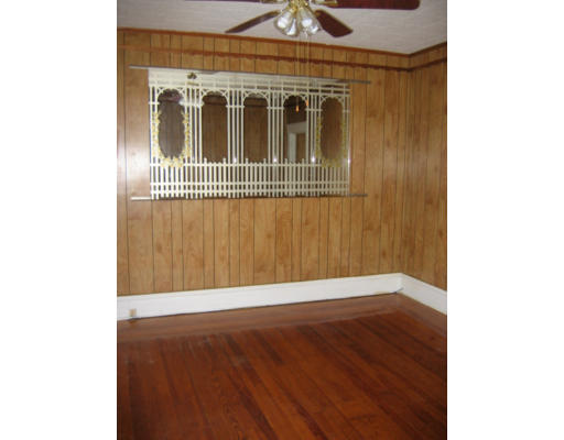 43 William Street Fall River, MA 02721 - Photo 7 of 7 a view of an empty room with wooden floor