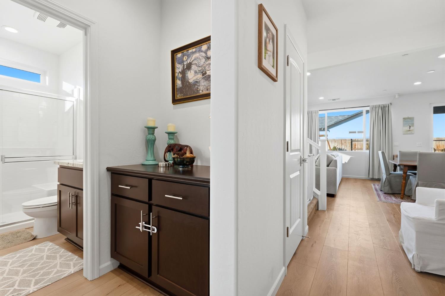 2566 Muscat Court Hanford, CA 93230 - Photo 14 of 55 a view of a hallway and room with wooden floor
