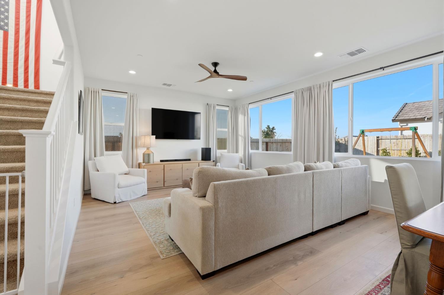 2566 Muscat Court Hanford, CA 93230 - Photo 16 of 55 a living room with furniture and a flat screen tv