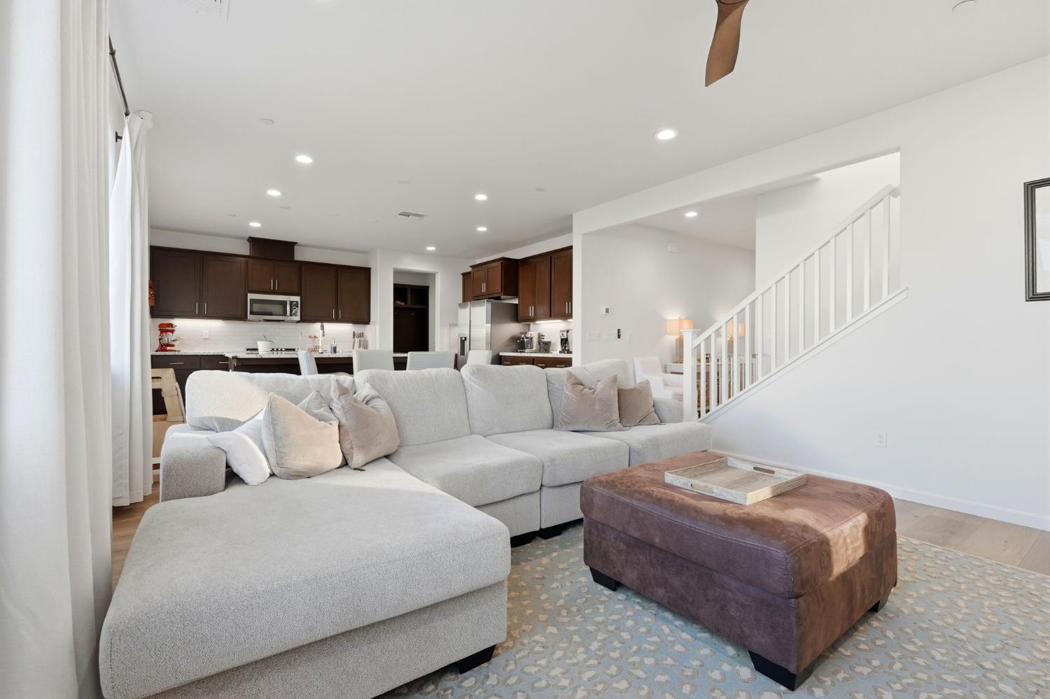 2566 Muscat Court Hanford, CA 93230 - Photo 19 of 55 a living room with furniture and a view of kitchen