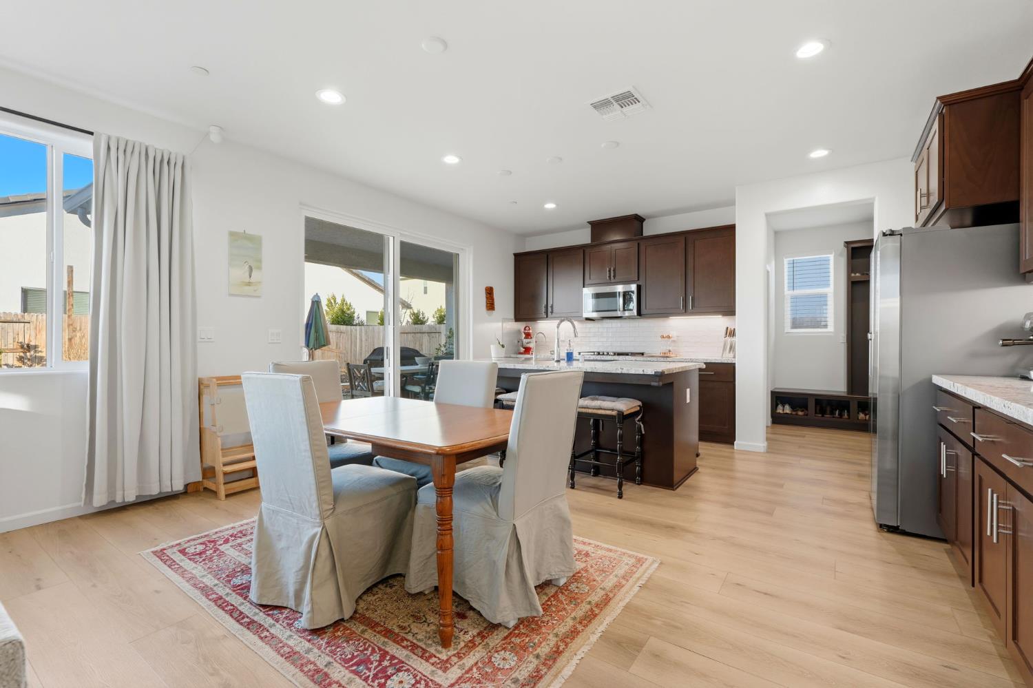 2566 Muscat Court Hanford, CA 93230 - Photo 20 of 55 a dining room with furniture and a kitchen